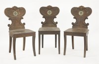 Lot 370 - Three Regency mahogany hall chairs