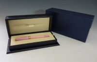 Lot 55 - A Chopard gold-plated and rose enamel ballpoint pen