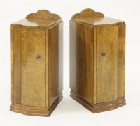 Lot 137 - A pair of Art Deco walnut 'cloud' bedside cupboards