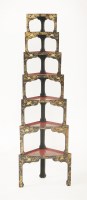 Lot 475 - A set of seven Japanese tortoiseshell and lacquered corner stacking tables