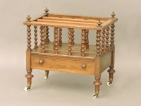 Lot 537 - A Victorian walnut canterbury