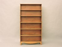 Lot 572 - A mahogany 'waterfall' bookcase with six shelves and reeded edges