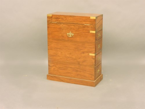 Lot 391 - A small Indonesian hardwood and brass bound campaign style Davenport desk