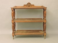 Lot 434 - A Victorian three tier buffet with turned supports