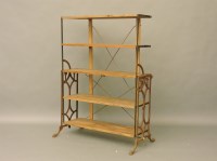 Lot 459 - A metamorphic iron framed book shelf/table