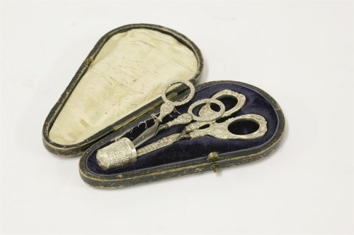 Lot 78 - Two sewing scissors and thimble