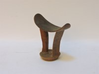 Lot 113 - An early 20th century carved African headrest