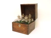 Lot 125 - A Georgian mahogany and inlaid four bottle decanter box