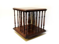 Lot 144 - An Edwardian square oak table top revolving book stand