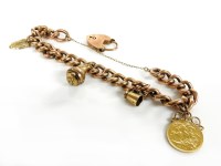 Lot 16 - A gold curb bracelet marked 9ct with padlock