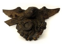 Lot 136 - A Black Forest style carved wood eagle and serpent figure