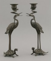 Lot 116 - A pair of bronze candlesticks