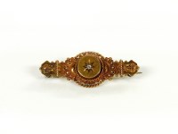 Lot 1 - A Victorian 15ct gold Etruscan style bar brooch