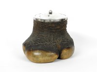 Lot 112 - An Edwardian silver mounted rhinoceros foot tobacco jar
