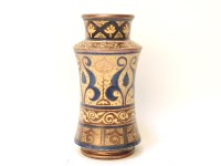 Lot 109 - A Deruta style albarello 
with copper lustre and blue bands of decoration