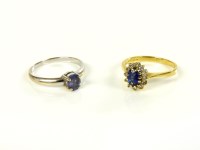 Lot 29 - An 18ct gold sapphire and diamond cluster ring