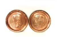 Lot 129 - A pair of embossed copper circular trays