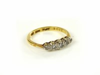 Lot 35 - A gold five stone diamond ring