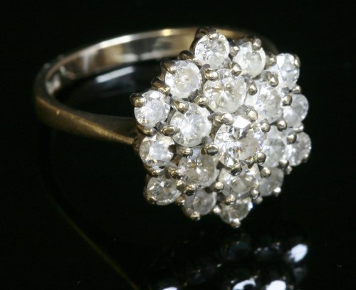 Lot 37 - An 18ct white gold diamond set hexagonal cluster ring