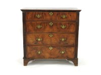 Lot 528 - A walnut four drawer graduated chest