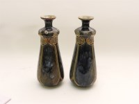 Lot 237 - A pair of Royal Doulton stoneware bottle vases