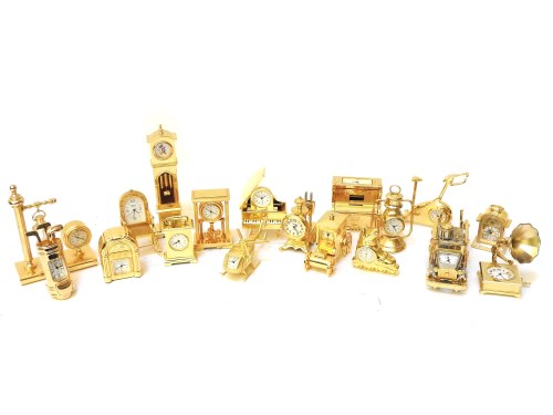 Lot 193 - Nineteen miniature gilt metal novelty clocks