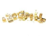 Lot 195 - Eighteen miniature gilt metal novelty clocks