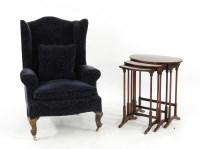 Lot 577 - A George III style wingback armchair