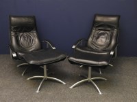 Lot 566 - A pair of modern leather swivel chairs