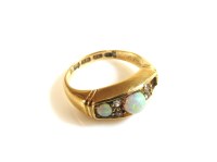 Lot 23 - An 18ct gold three stone opal boat shaped ring