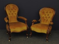 Lot 446 - Two Victorian carved walnut armchairs