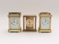 Lot 243 - Two early 20th century brass carriage time pieces