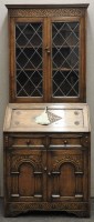 Lot 466 - An oak bureau bookcase