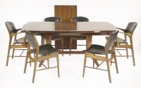 Lot 275 - A Gordon Russell mahogany and Bombay rosewood dining table
