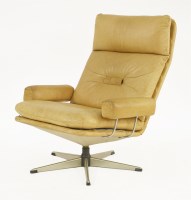 Lot 371 - A tan leather lounge armchair