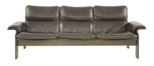 Lot 406 - A laminated three-seater leather settee