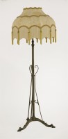 Lot 49 - An Arts and Crafts brass adjustable standard lamp