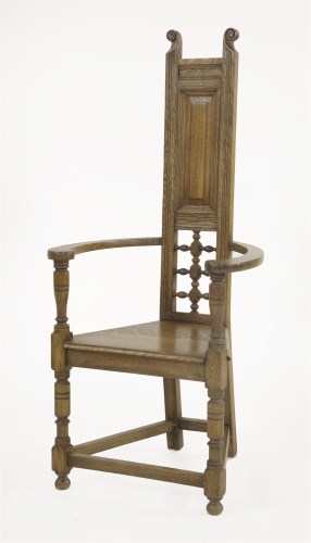 Lot 69 - An Arts and Crafts oak armchair