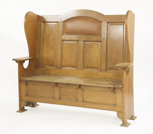 Lot 82 - An Arts and Crafts oak settle