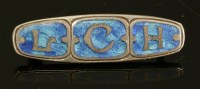 Lot 2 - A sterling silver Arts and Crafts enamel brooch