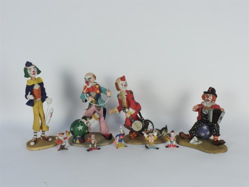 Lot 365 - A collection of four hand painted clowns