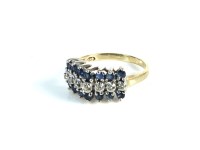 Lot 34 - A gold diamond and sapphire three row ring