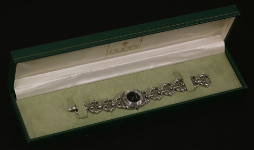 Lot 76 - A ladies stainless steel Gucci quartz bracelet watch