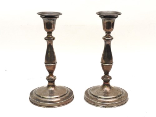 Lot 179 - A pair of 20th century candlesticks