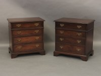 Lot 598 - A pair of small reproduction chest of 4 graduated drawers