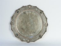 Lot 128 - A Continental silver dish set with cabochon stones to the rim.