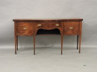 Lot 643 - A Georgian and later inlaid mahogany serpentine shape sideboard