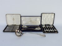 Lot 331 - A set of twelve silver teaspoons and matching sugar tongs
