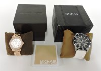 Lot 1037 - A PVD rose-plated stainless steel Michael Kors ladies' quartz bracelet watch
