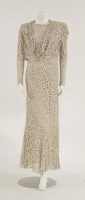 Lot 1185 - A beige lace dress
